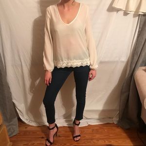 Small white, flowy-sleeved blouse